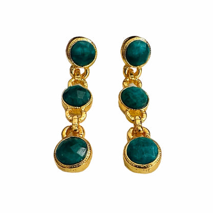 Handmade gold-plated multi-stone emerald and chain dangle earrings on white background 
