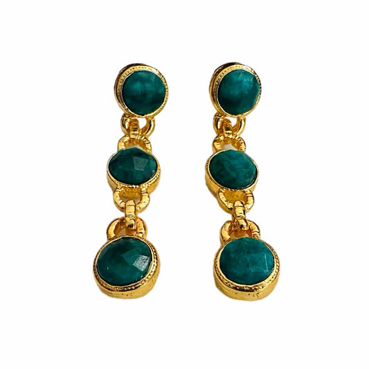Handmade gold-plated multi-stone emerald and chain dangle earrings on white background 