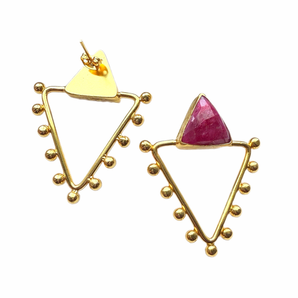 Handmade gold-plated triangle earrings with gold accents balls and faceted triangle ruby on white space 