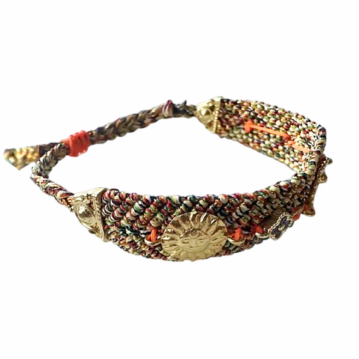 Handmade orange blue woven cord bracelet with gold-plated evil eye charm and zircon on a plain surface