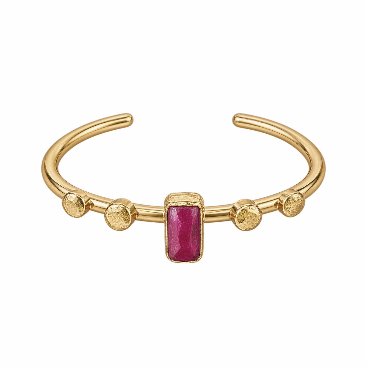A gold-plated cuff bracelet featuring a central rectangular ruby gemstone and four textured gold beads spaced along the band, set against a plain white background.