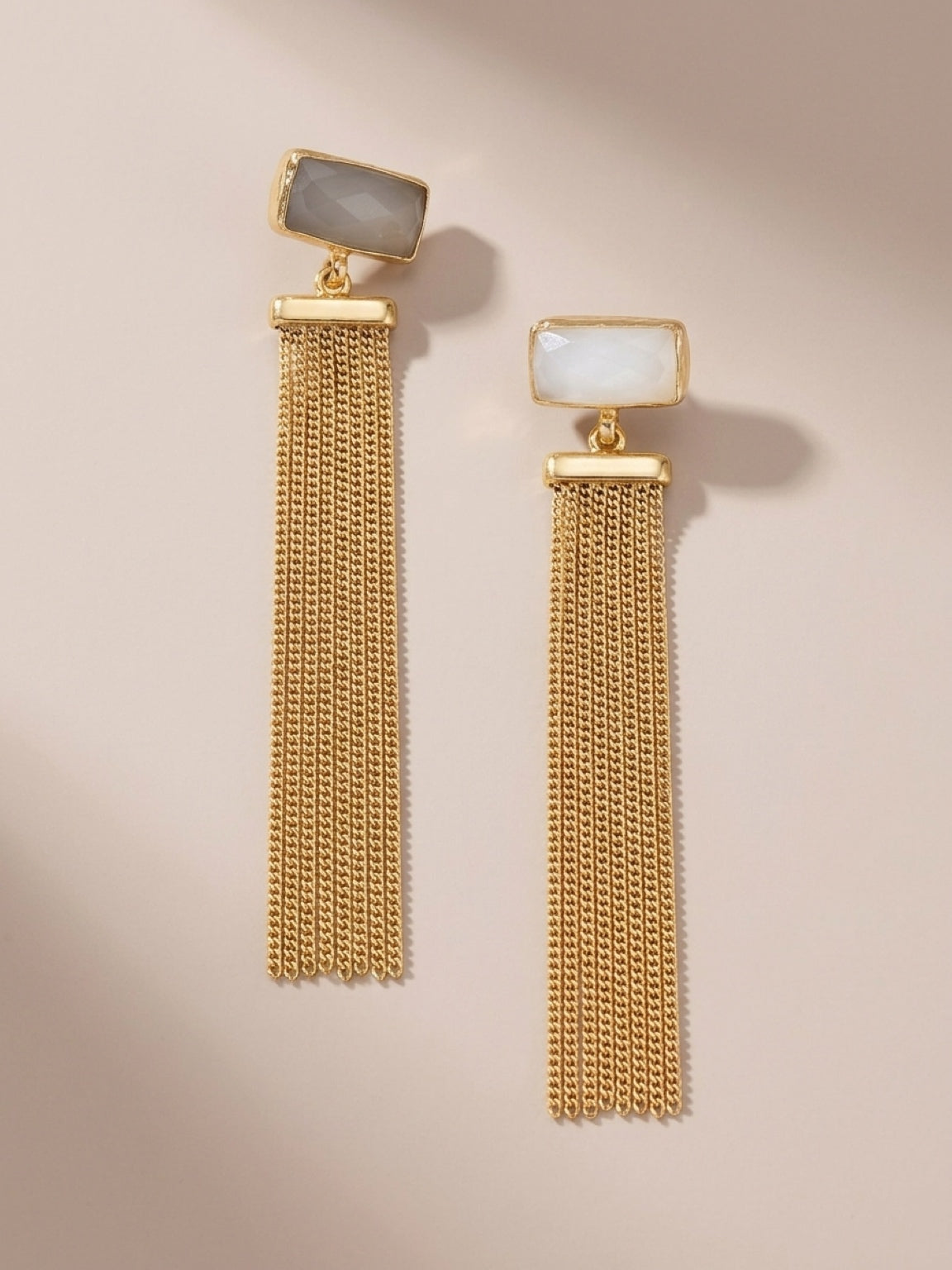 Handmade sustainable gold-plated snow quartz chain tassel earrings on beige
