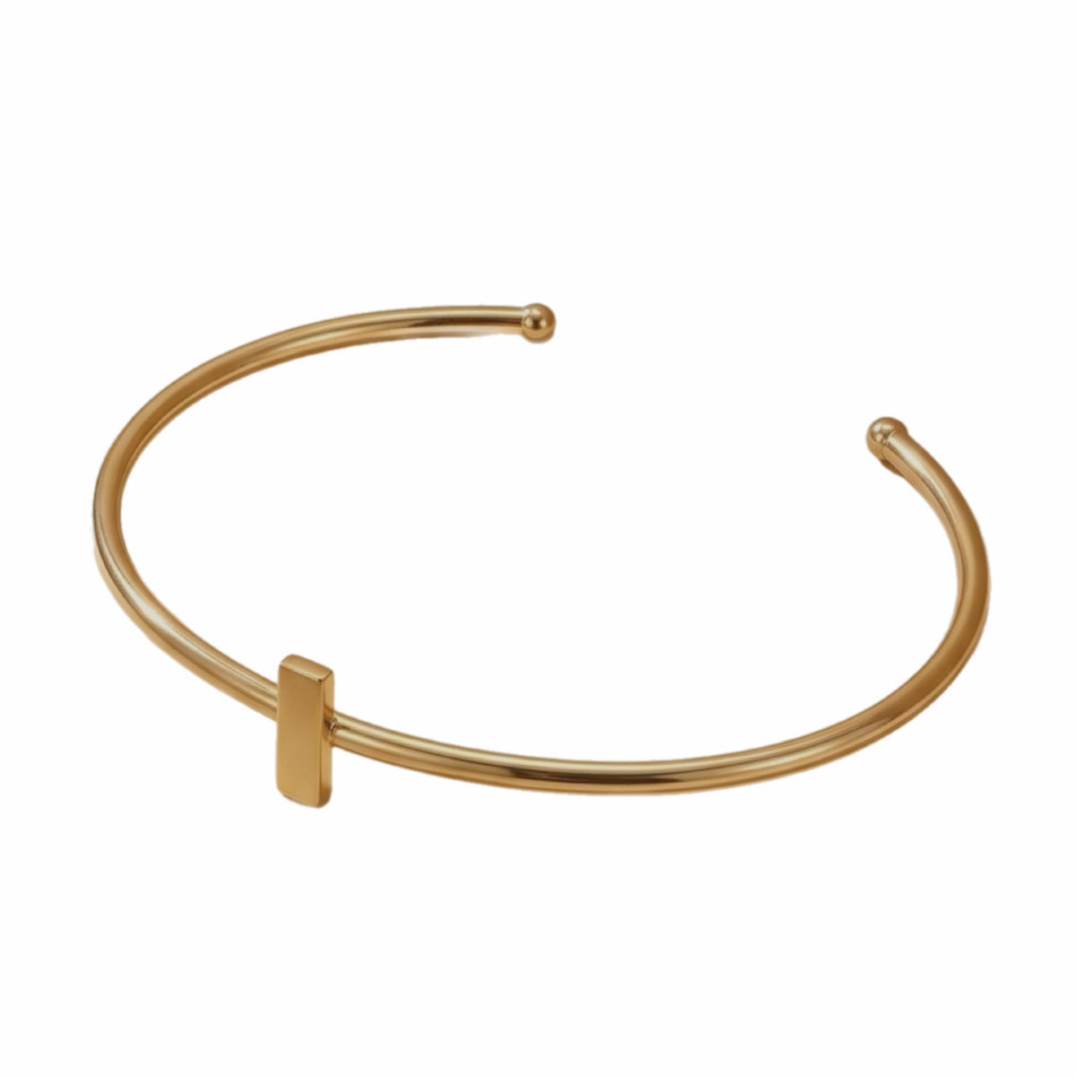 Dainty stackable Gold-plated bracelet with minimal bar on a white surface 