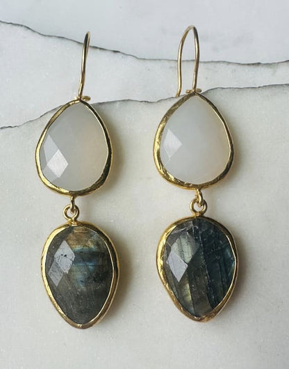 Handmade sustainable Gold-plated teardrop labradorite and snow Quartz dangle earrings with on a marble surface
