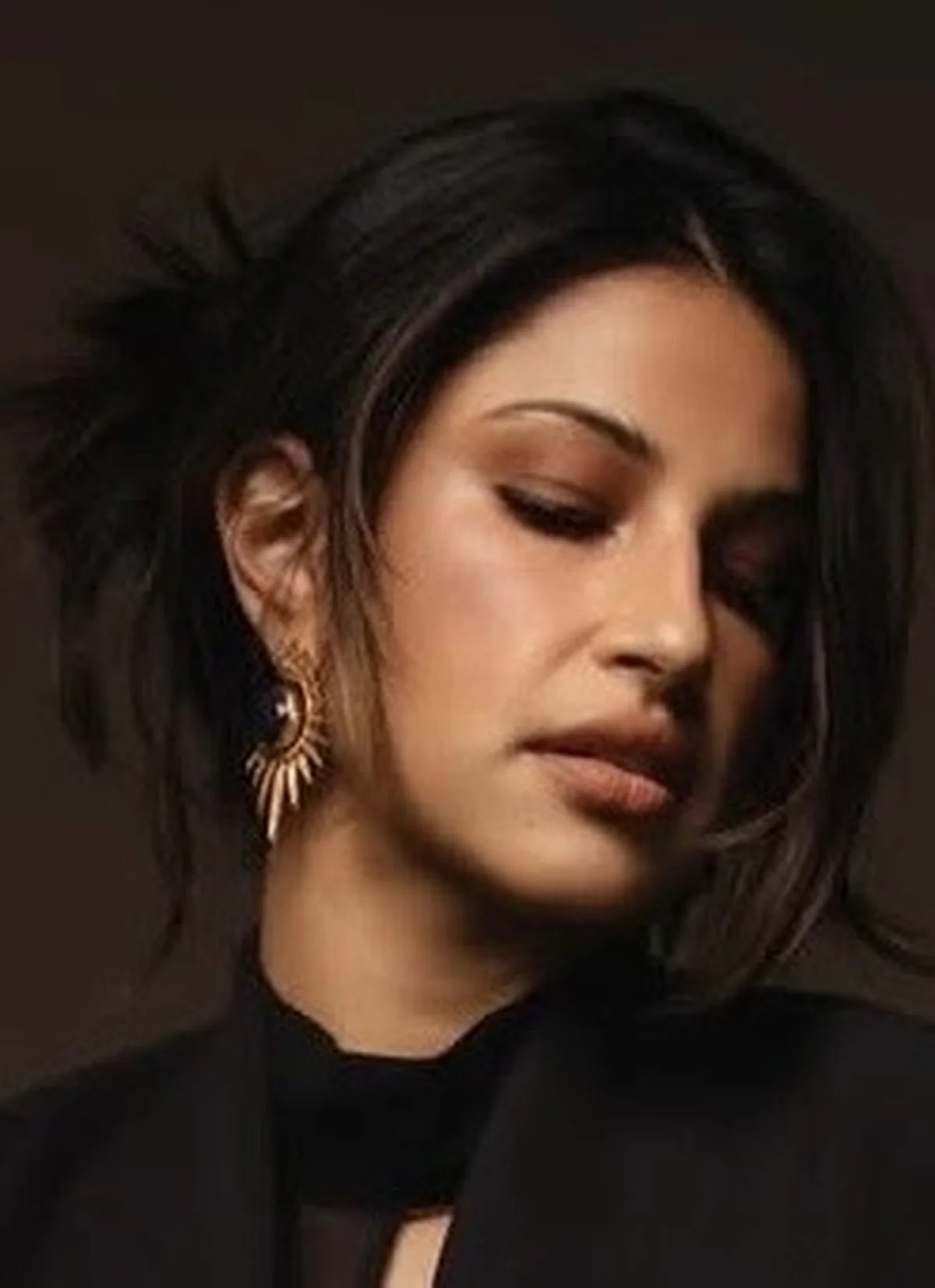 Indian American actor Richa Moorjani wears gold and lapis lazuli earrings by Bebek Jewels for pregnancy photo shoot