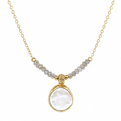 A gold chain minimal flat pearl pendant necklace with a row of small gray beads across upper center