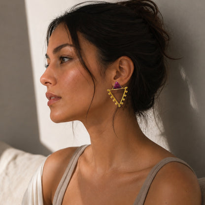 Model with aritzia loungewear wearing handmade gold-plated contemporary triangle earrings with ruby in lifestyle image 