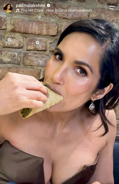 Padma Lakshmi eating a taco in LA after a red carpet event wearing evil eye earrings by Bebek Jeweks 