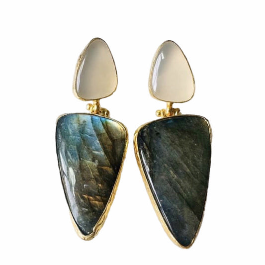Pair of artisanal sustainable gold-plated snow Quartz and green stone bold statement earrings on a plain white backdrop 