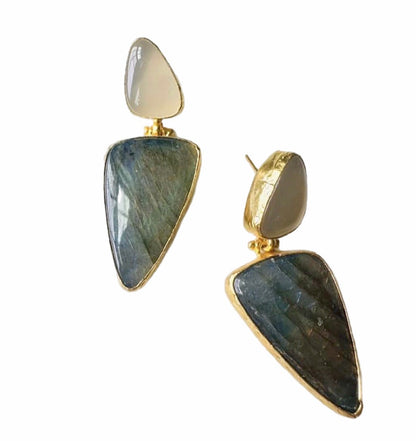 Pair of artisanal sustainable gold-plated snow Quartz and green stone bold statement earrings on a White surface 