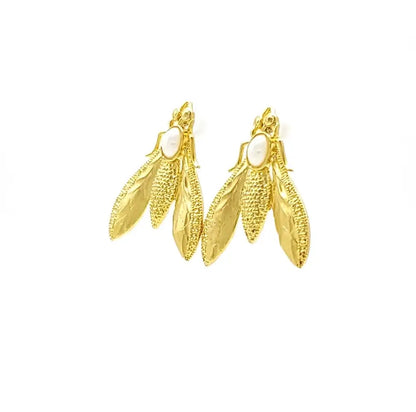 Stylish handmade sustainable gold-plated bee earrings facing right against white background 