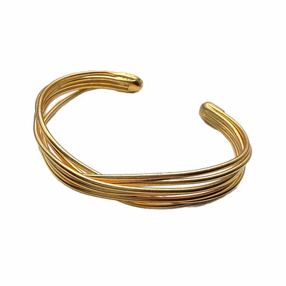 Side angle of Gold-plated wire bracelet on a white background 