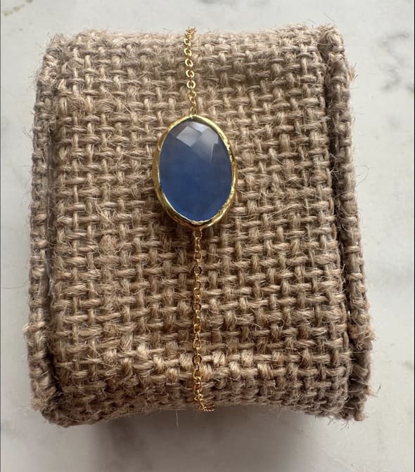 Handmade gold-plated Chain Bracelet with blue chalcedony stone on woven fabric