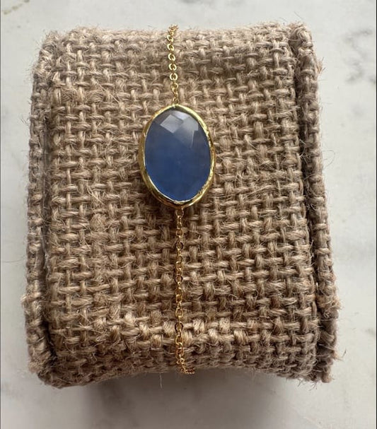 Handmade gold-plated Chain Bracelet with blue chalcedony stone on woven fabric