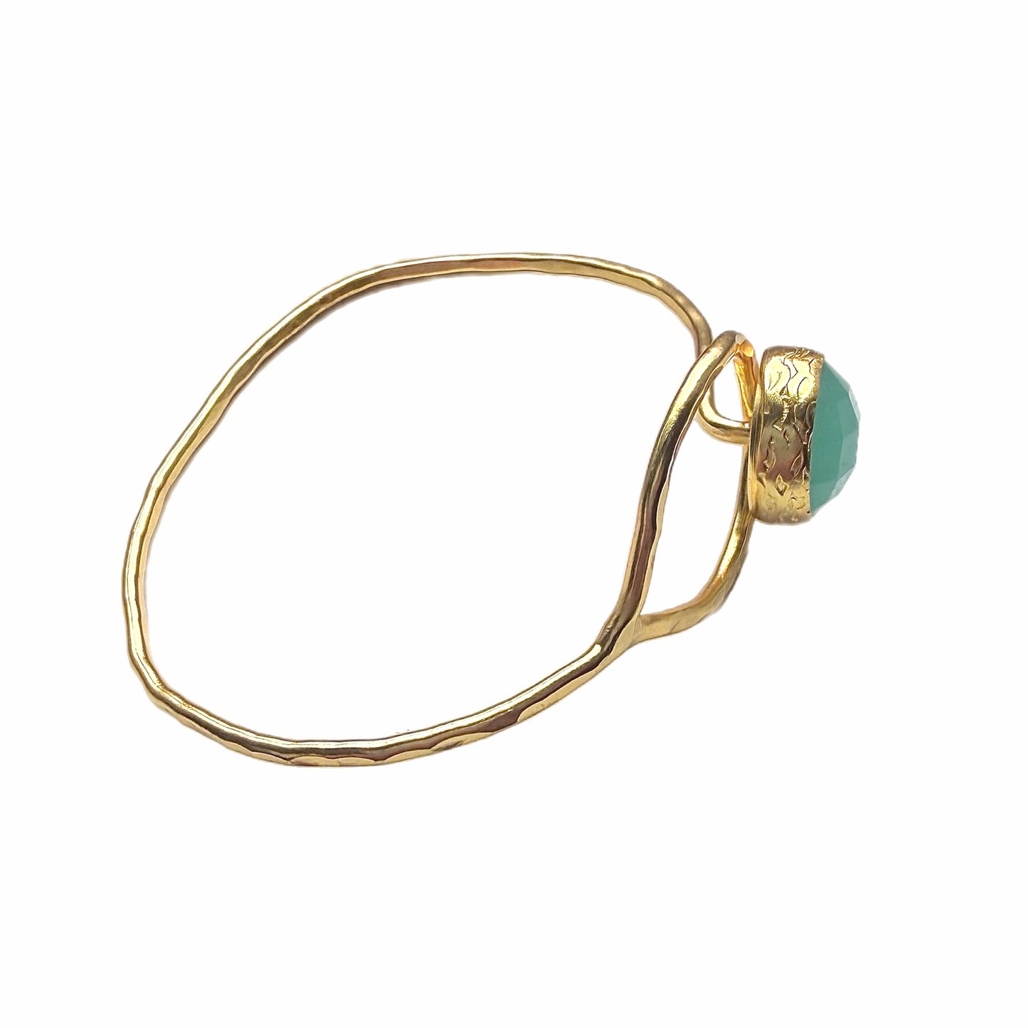 Gold-plated bracelet with aqua chalcedony round stone on a white surface