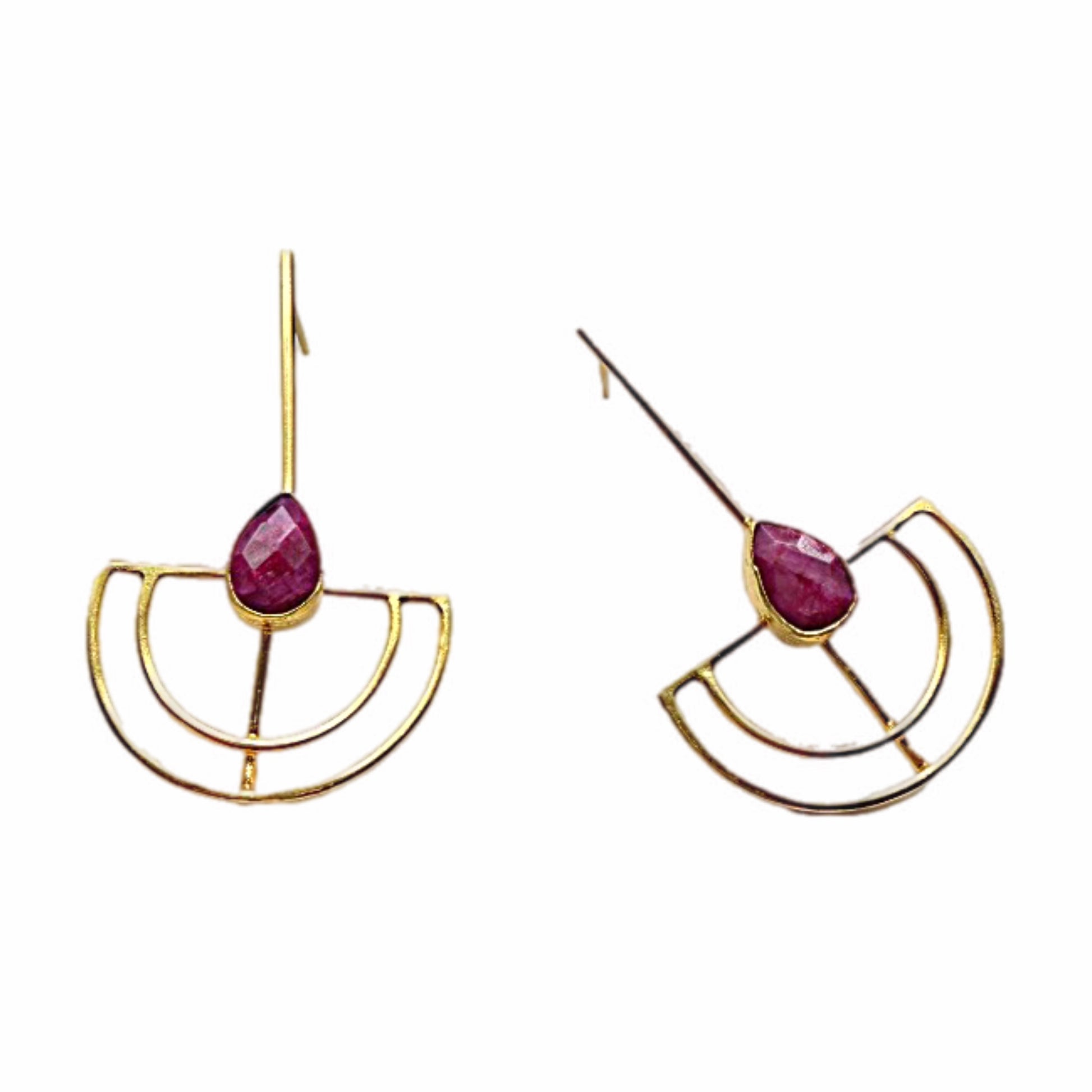 Gold-plated artisanal sustainable contemporary long geometric earrings with Ruby on a white backdrop 