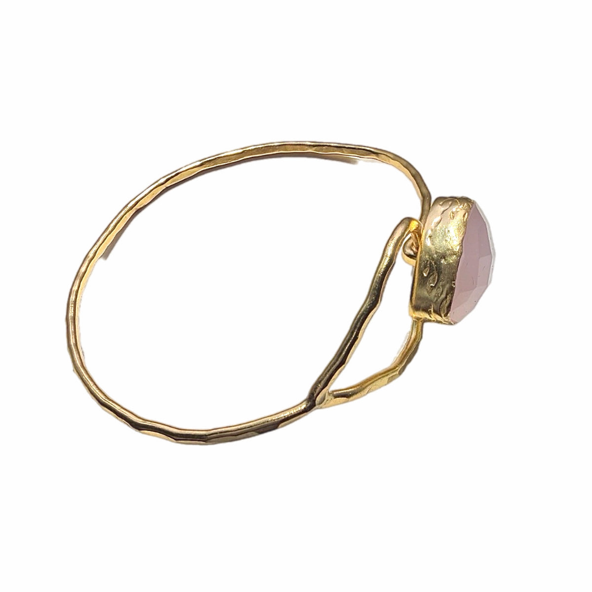 Handmade Gold bracelet with a pink gemstone on a white background-facing-right-side