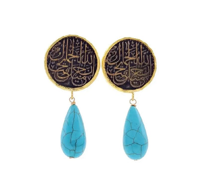Handmade sustainable gold-played Arabic calligraphy old world Muslim Earrings with turquoise teardrop pendants on a white background