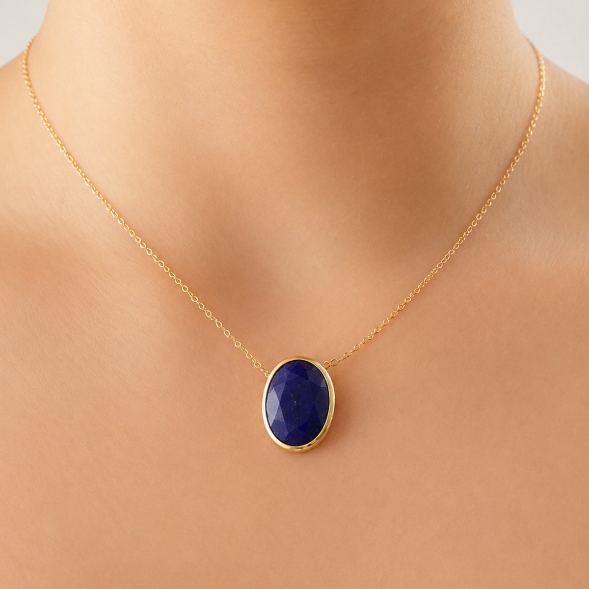 minimal gold chain faceted lapis lazuli pendant necklace on models neck