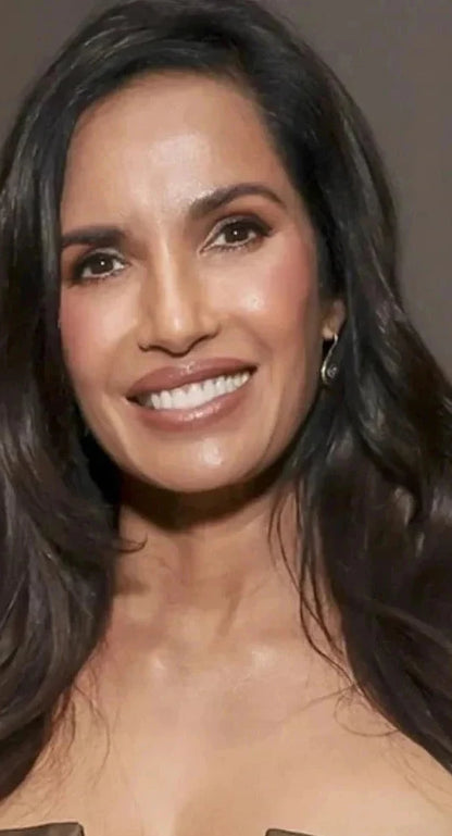 Padma Lakshmi wearing a brown dress with floral embellishments against a neutral background for event in LA with Bebek Jewels evil eye earrings 