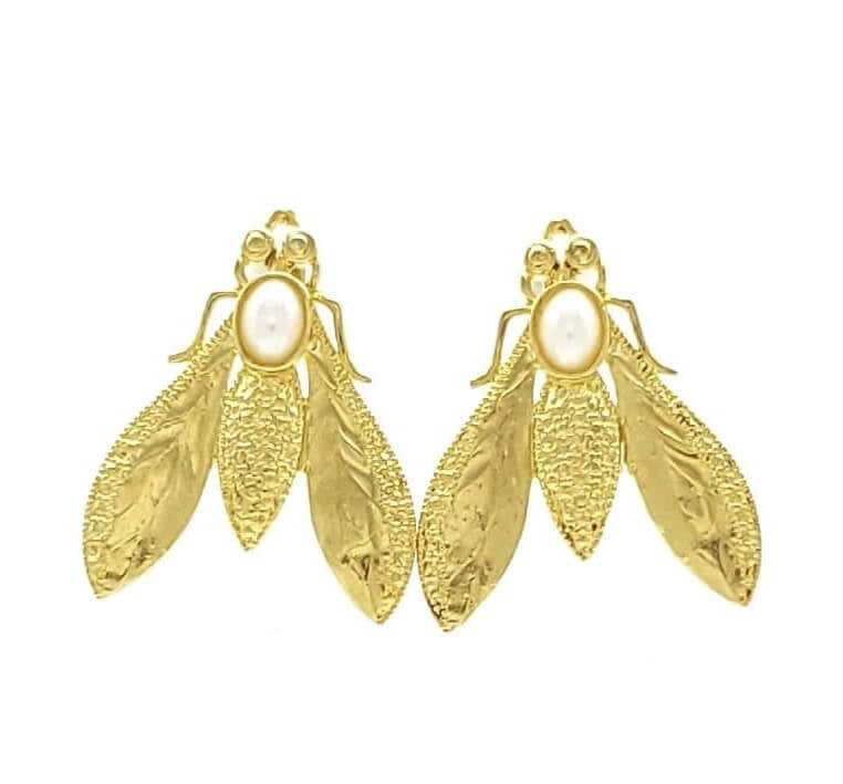 Stylish handmade sustainable gold-plated bee statement earrings with white pearl against white background 
